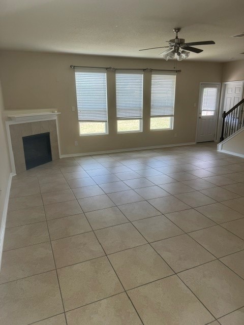 2529 Magnolia Fair Way Spring, TX 77386 - Photo 5 of 32 Very spacious den with fireplace and ceiling fan. Tile is light cream and beige and all rooms have natural light. Interior was newly painted throughout the home with beige and cream paint.