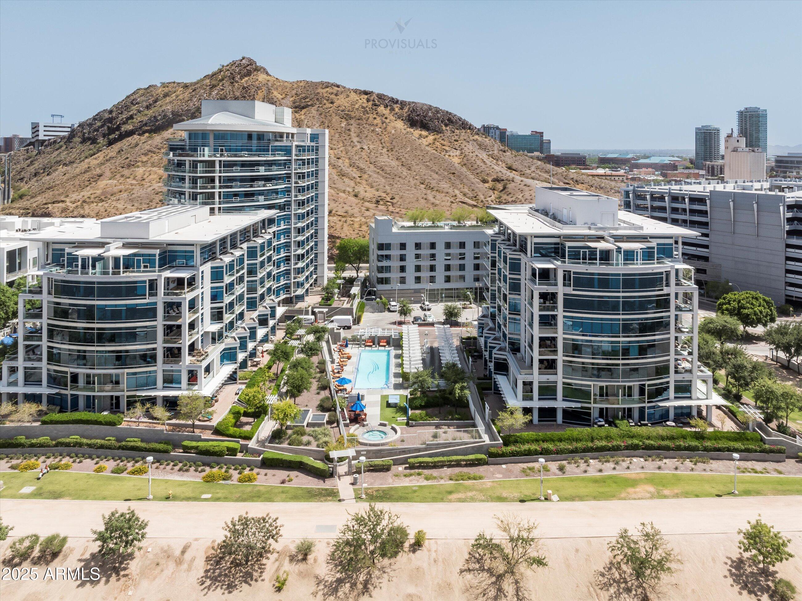 a view of a large building with a swimming pool