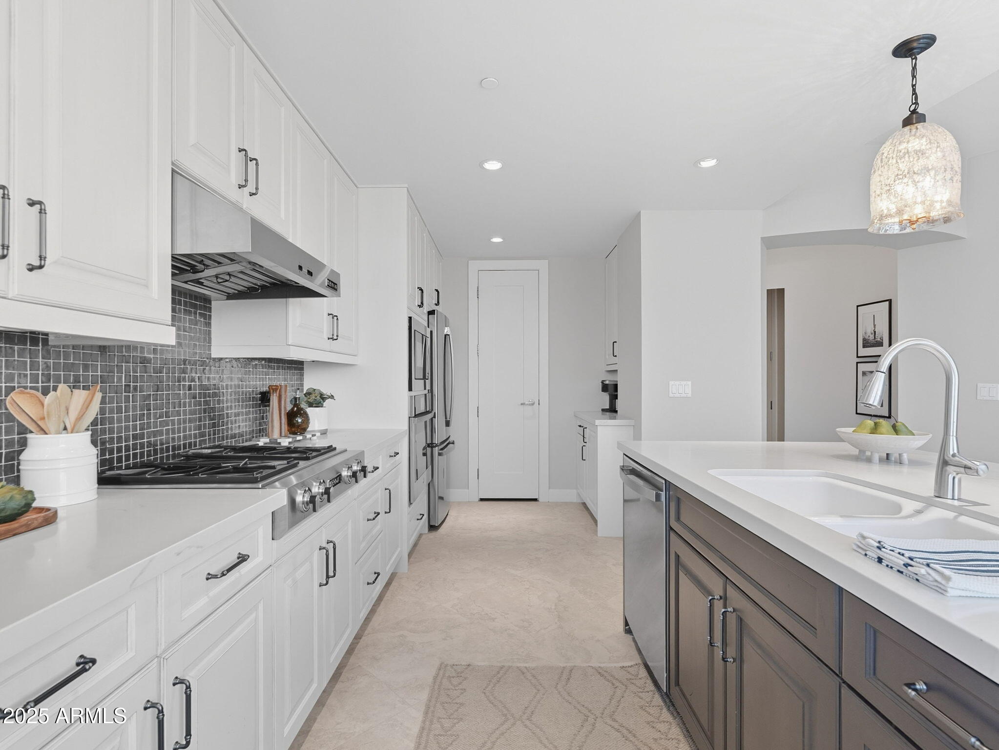 140 East Rio Salado Parkway, Unit 512 Tempe, AZ 85281 - Photo 11 of 41 a kitchen with granite countertop a sink stove and cabinets