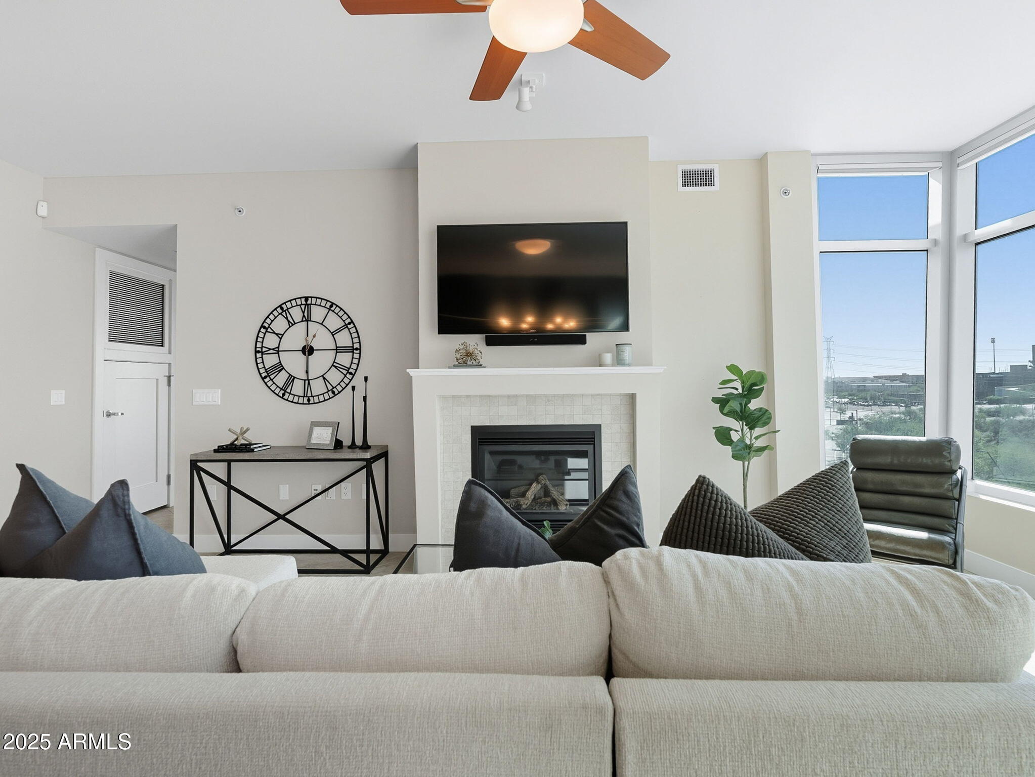 140 East Rio Salado Parkway, Unit 512 Tempe, AZ 85281 - Photo 17 of 41 a living room with furniture a flat screen tv and a fireplace