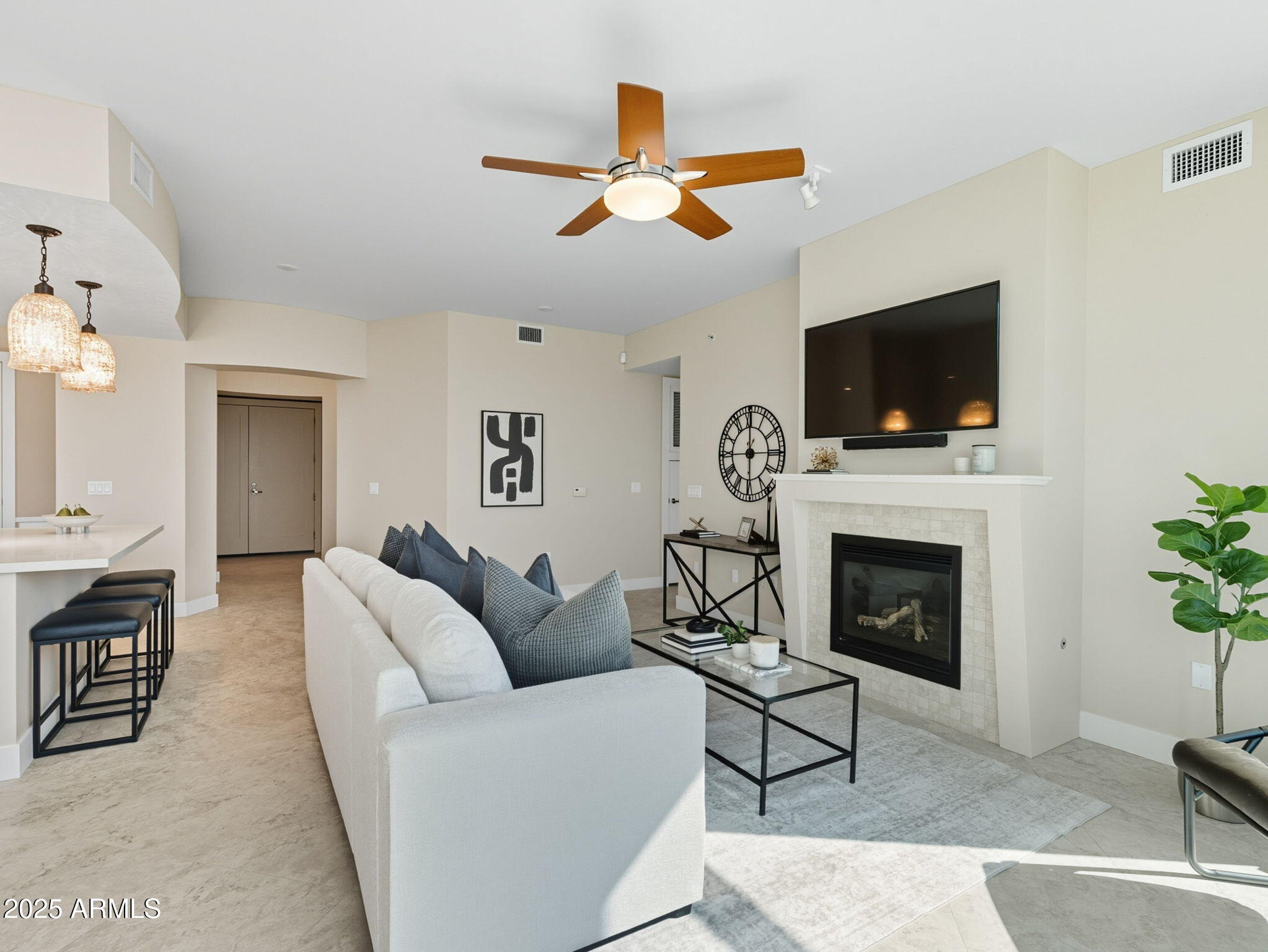 140 East Rio Salado Parkway, Unit 512 Tempe, AZ 85281 - Photo 18 of 41 a living room with furniture a fireplace and a flat screen tv