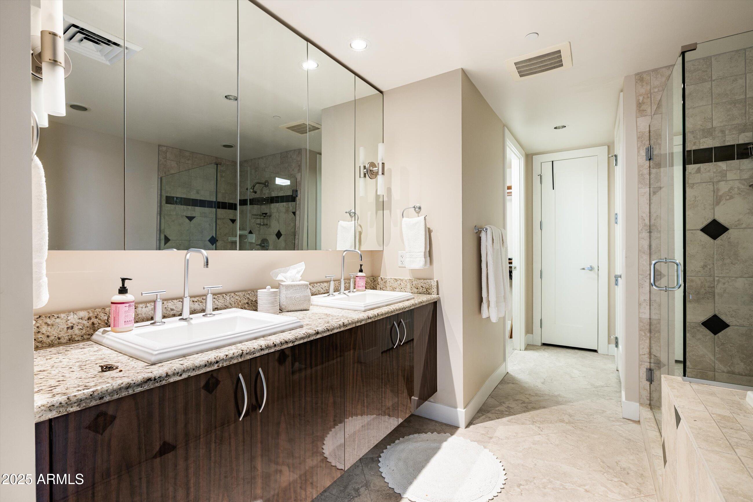 140 East Rio Salado Parkway, Unit 512 Tempe, AZ 85281 - Photo 27 of 41 a bathroom with a double vanity sink mirror and shower