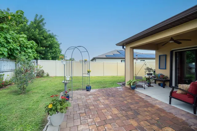 a house view with a sitting space and garden
