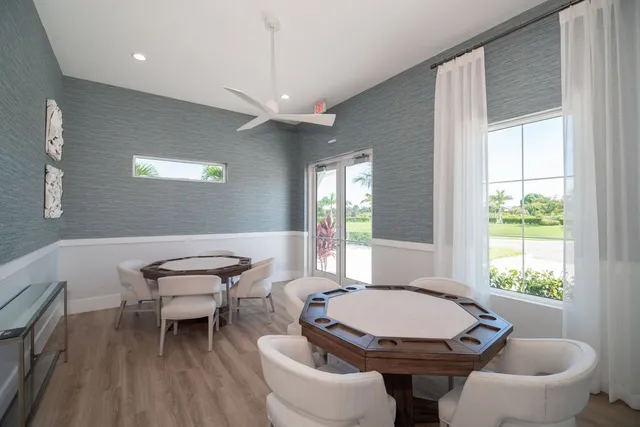 a living room with furniture a window and a chandelier