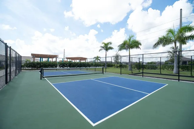 a view of tennis court with houses in it