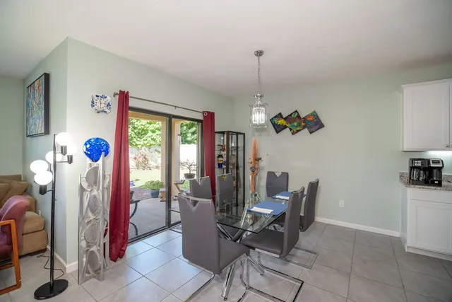 a dining room filled with furniture and window