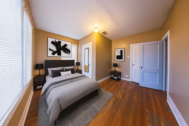 a bedroom with a bed and a view of bathroom