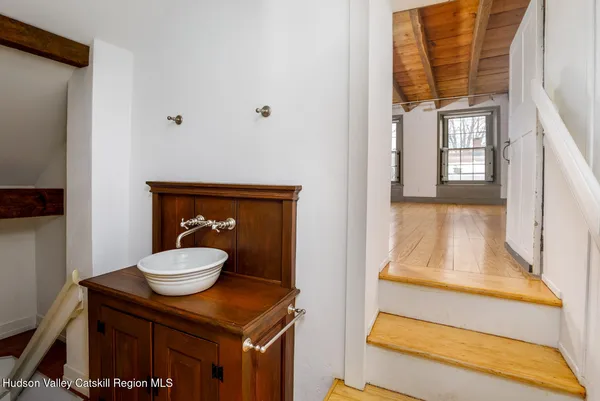 a bathroom with a toilet a sink and a window