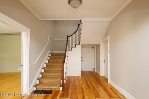 a view of entryway with wooden floor
