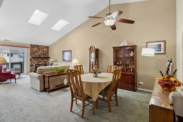 a dining room with furniture and window