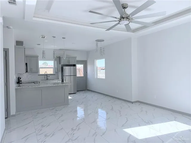 a view of a kitchen with a sink and cabinet area