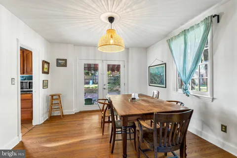 a view of a dining room with furniture and window