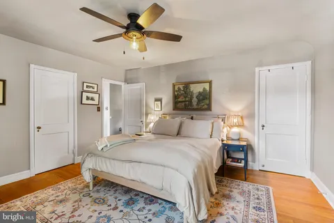 a bedroom with a bed and a table in it