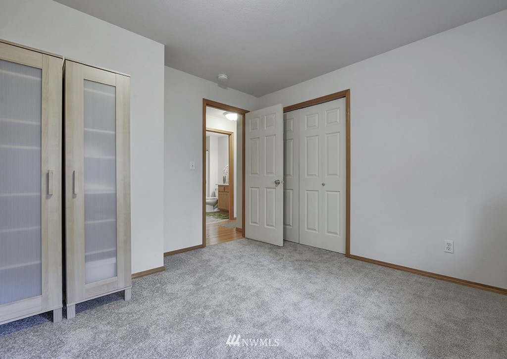 21616 Southeast Wax Road Maple Valley, WA 98038 - Photo 14 of 23 an empty room with closet area