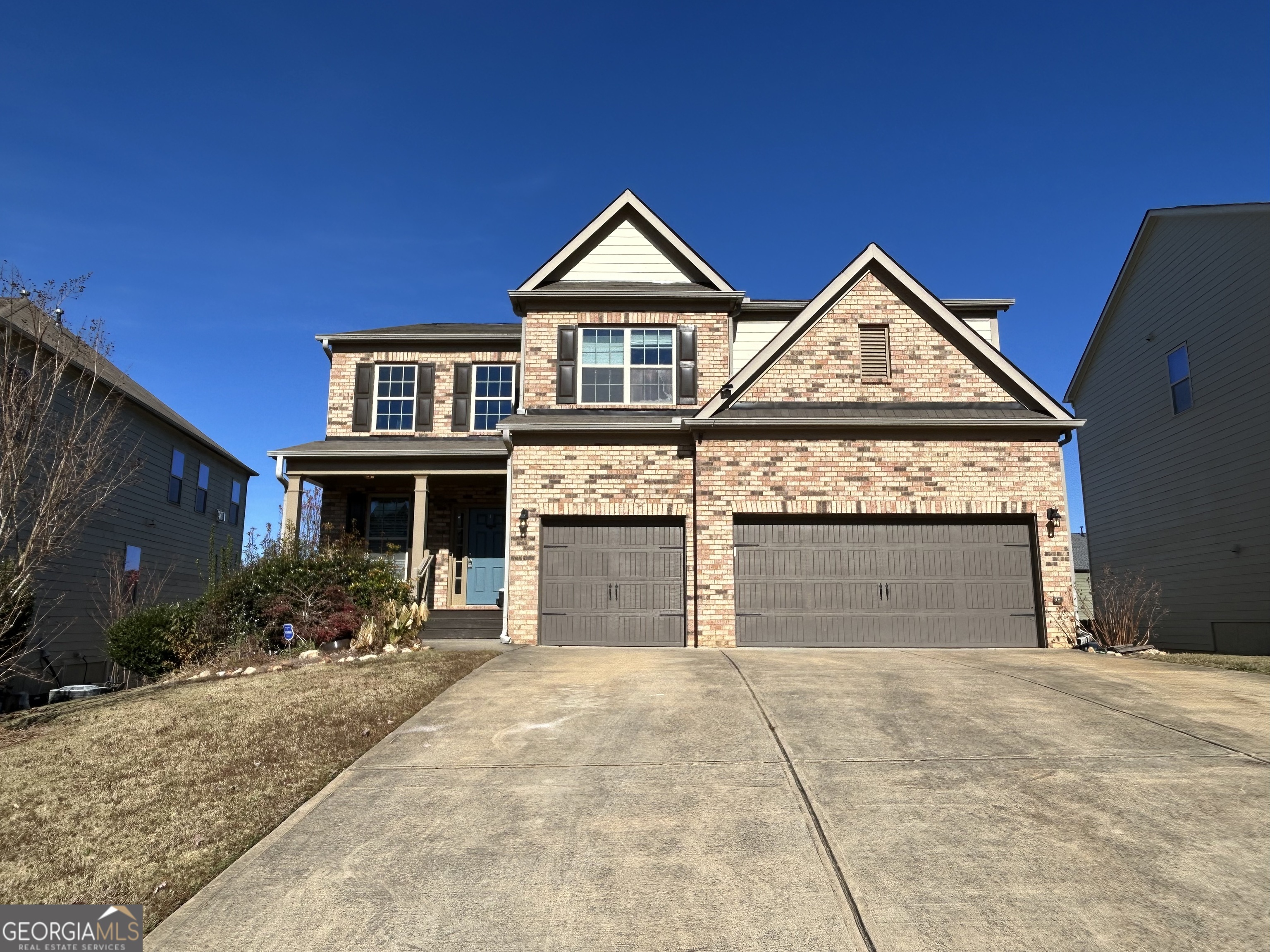 611 Ceremony Way Acworth, GA 30102 - Photo 1 of 20 a front view of a house with a yard and garage
