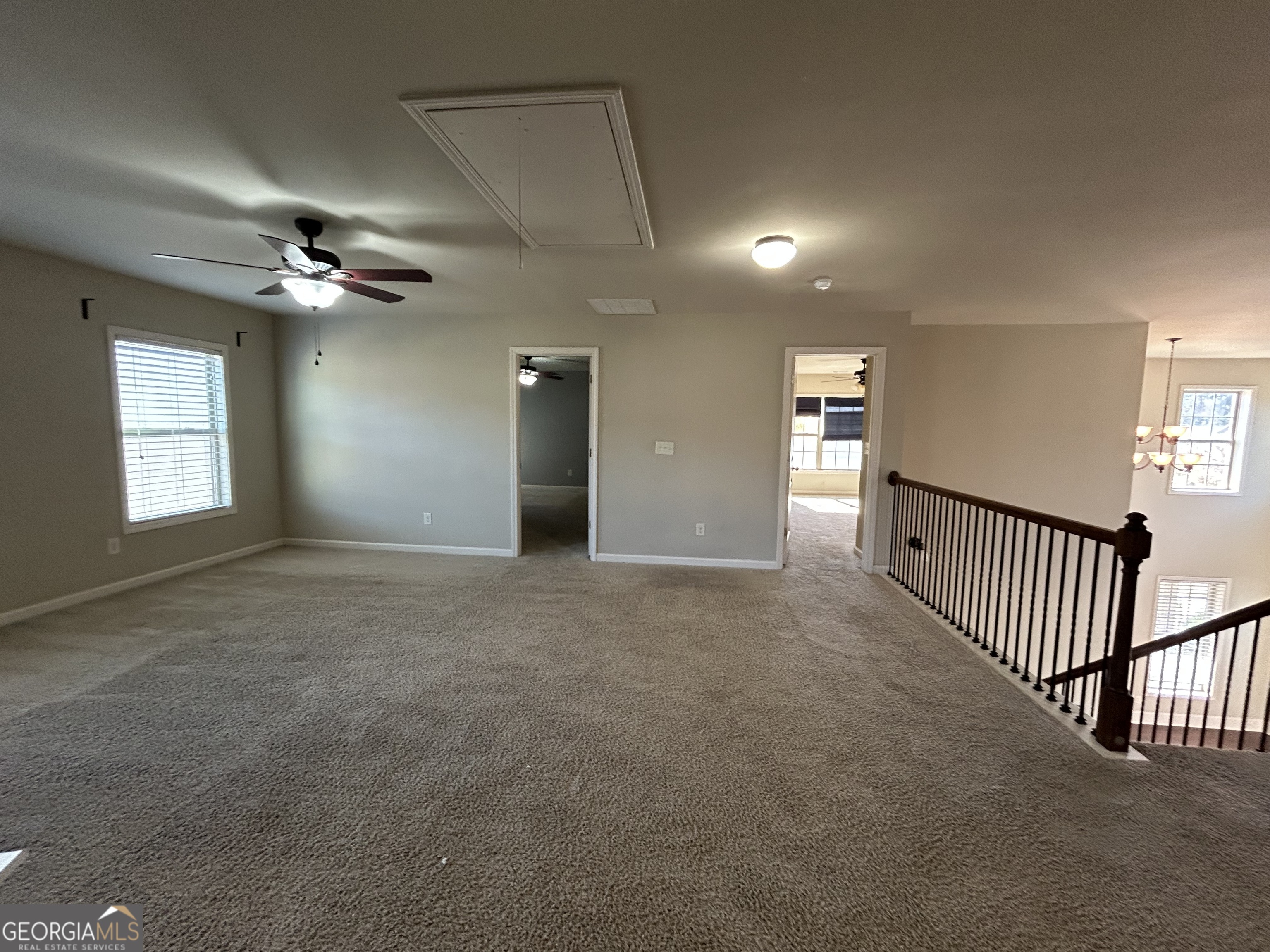 611 Ceremony Way Acworth, GA 30102 - Photo 11 of 20 a view of a hallway with a chandelier fan