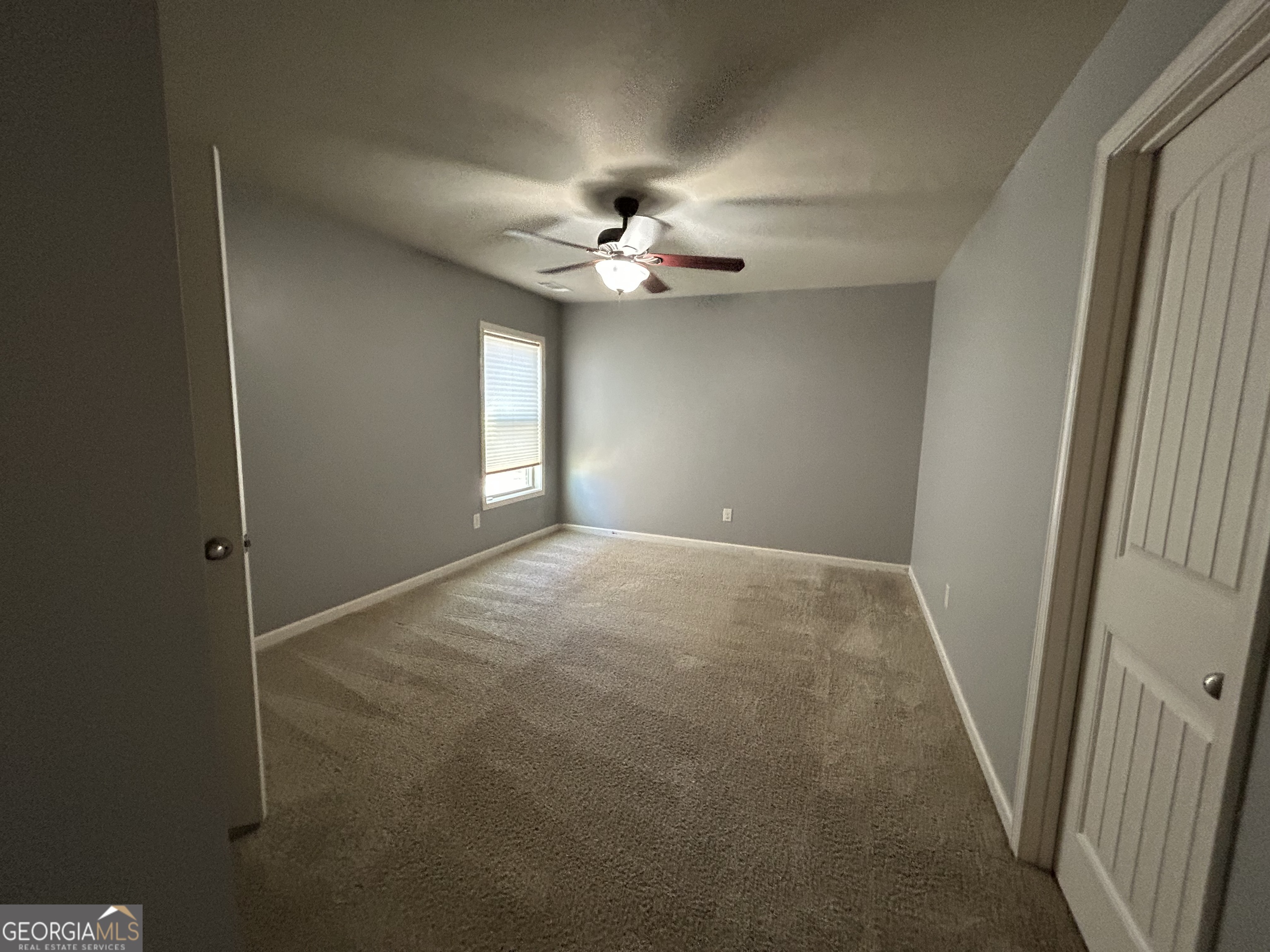 611 Ceremony Way Acworth, GA 30102 - Photo 12 of 20 an empty room with windows and fan