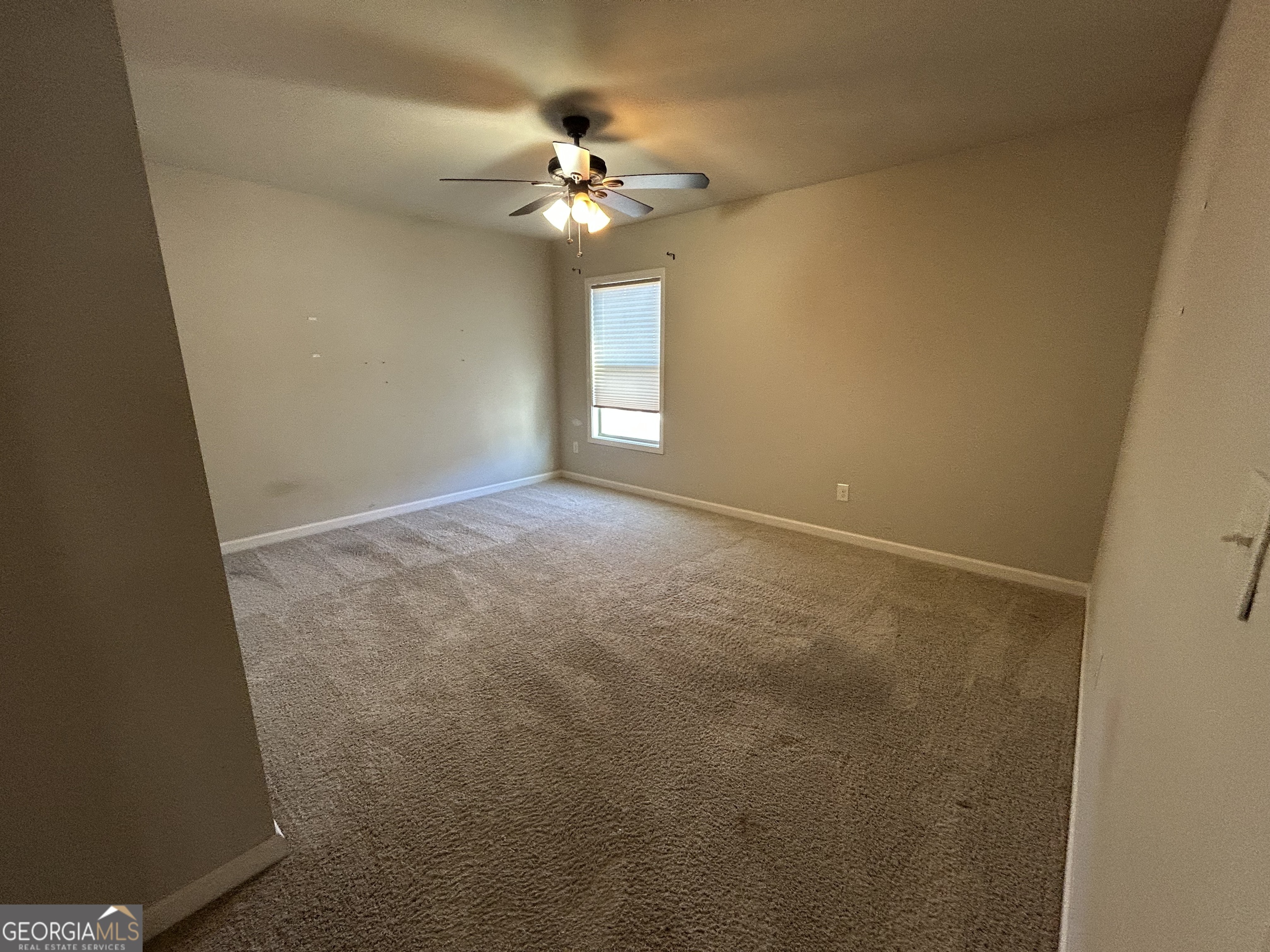 611 Ceremony Way Acworth, GA 30102 - Photo 13 of 20 a view of an empty room with a chandelier fan