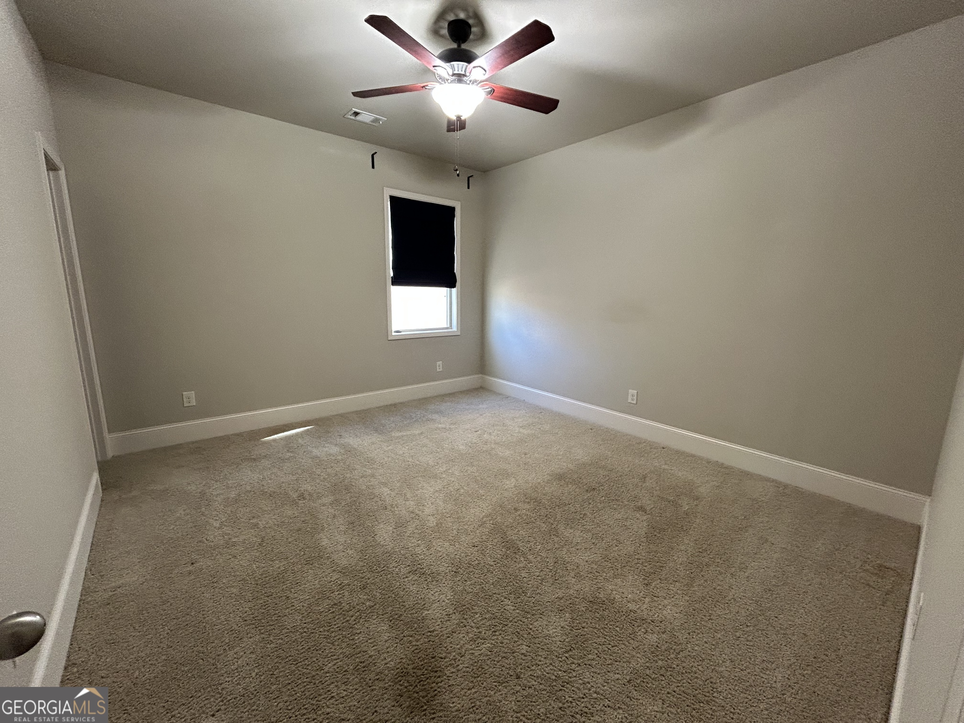 611 Ceremony Way Acworth, GA 30102 - Photo 16 of 20 an empty room with a window and a fan