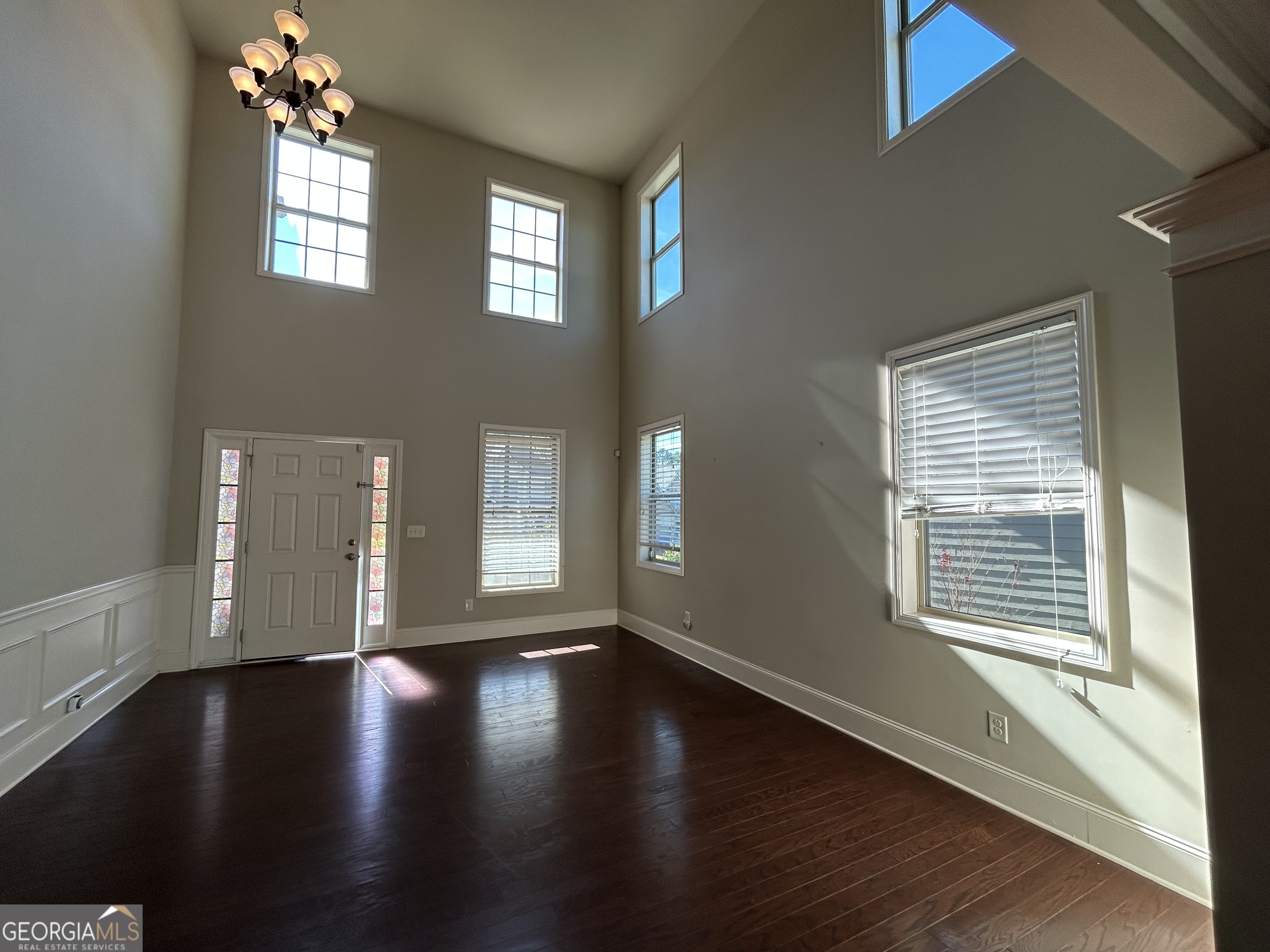611 Ceremony Way Acworth, GA 30102 - Photo 3 of 20 a view of an empty room with wooden floor and a window