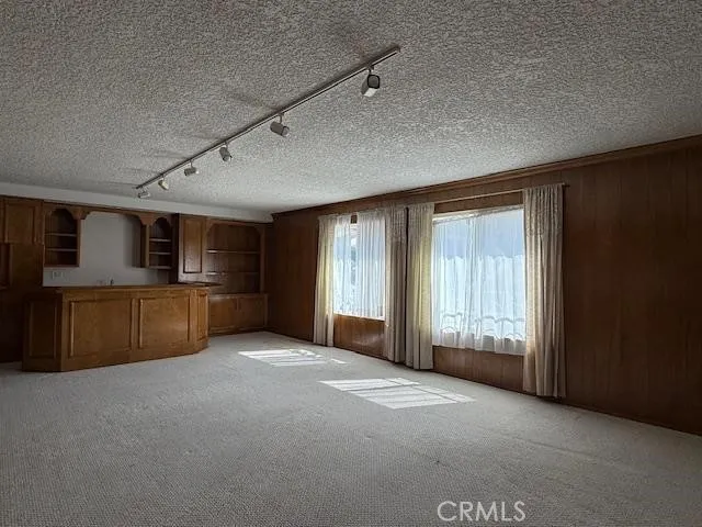 a spacious bathroom with a double vanity sink mirror and bathtub
