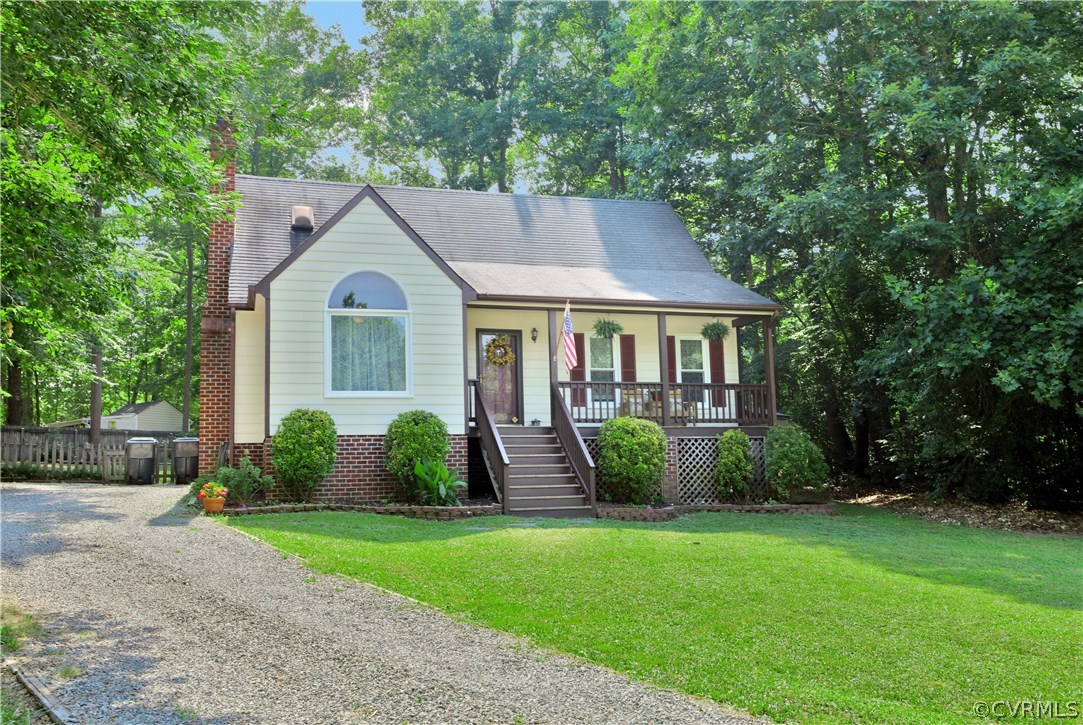 7118 Spring Trace Turn Midlothian, VA 23112 - Photo 1 of 34 a front view of a house with garden