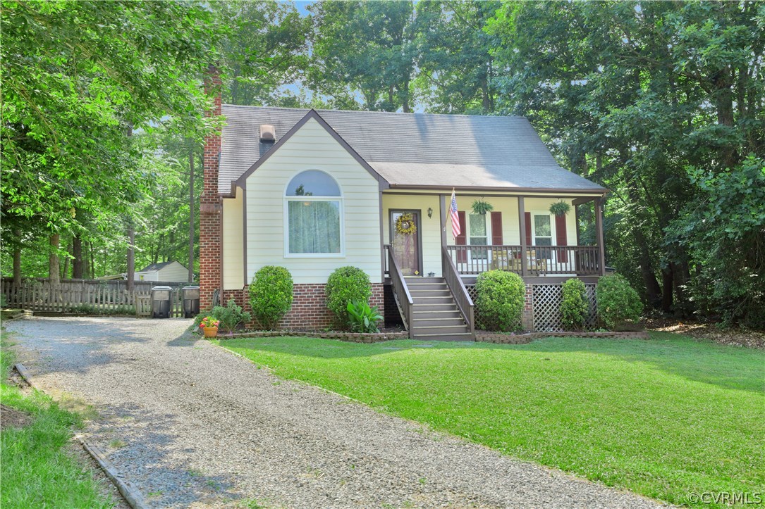 7118 Spring Trace Turn Midlothian, VA 23112 - Photo 2 of 34 a view of a house with a yard and plants