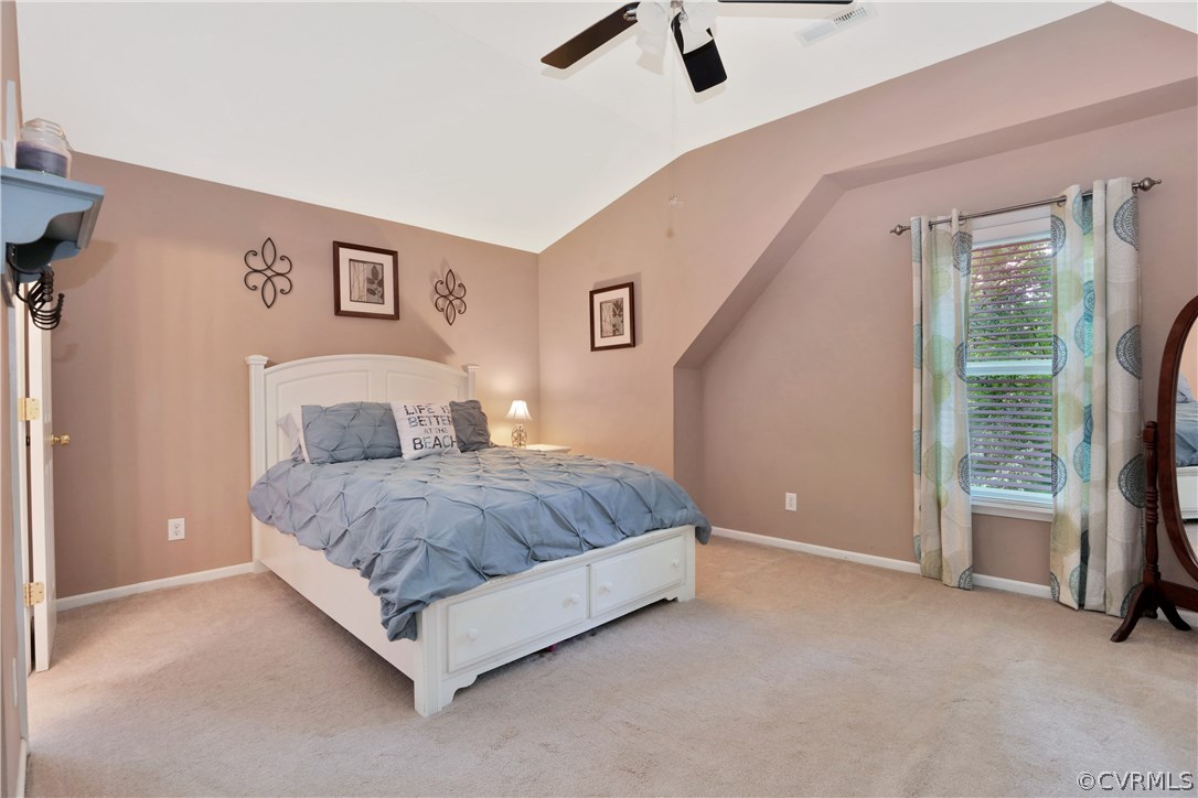 7118 Spring Trace Turn Midlothian, VA 23112 - Photo 22 of 34 a spacious bedroom with a bed and a cabinets