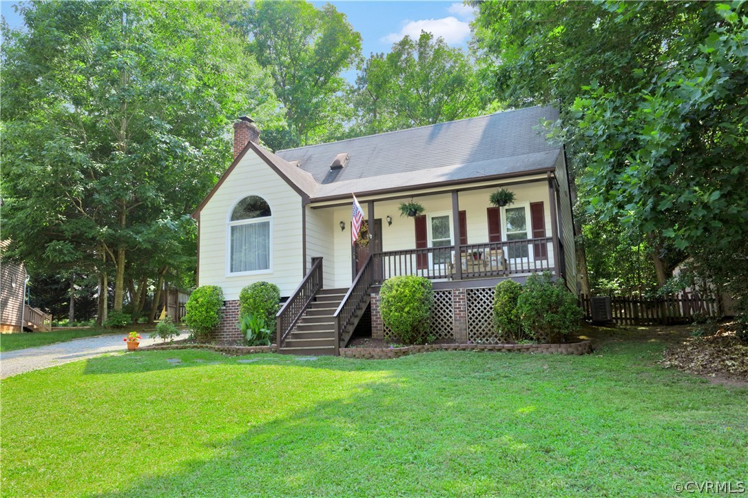 7118 Spring Trace Turn Midlothian, VA 23112 - Photo 33 of 34 front view of a house with a yard