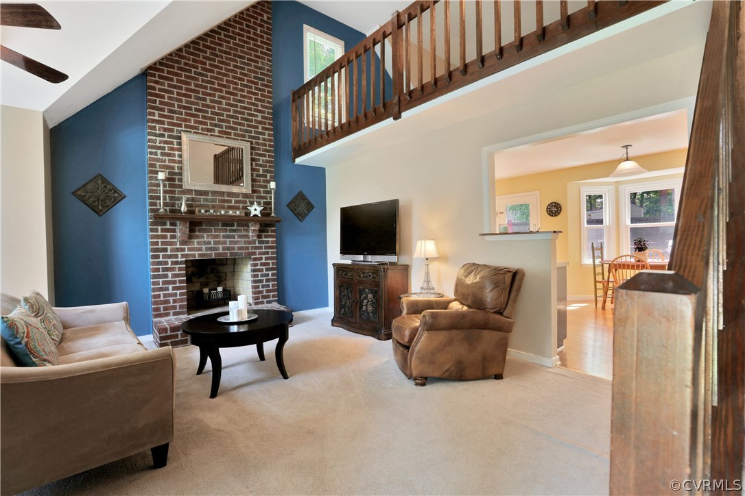 7118 Spring Trace Turn Midlothian, VA 23112 - Photo 5 of 34 a living room with furniture and a flat screen tv