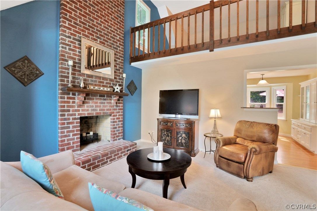 7118 Spring Trace Turn Midlothian, VA 23112 - Photo 6 of 34 a living room with furniture a fireplace and a flat screen tv