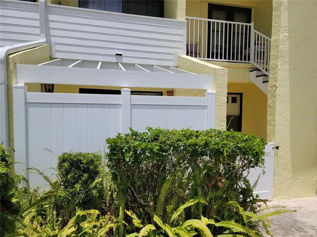 a view of a house with a flower plants