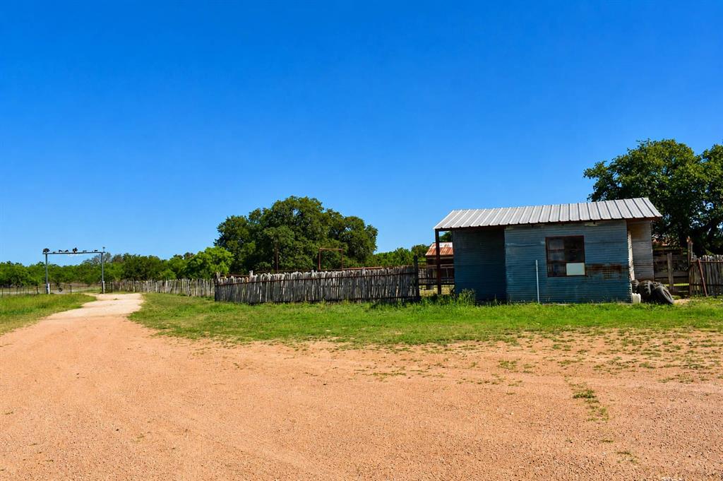 8228 Us Highway Rochelle, TX 76872 - Photo 34 of 36 a view of a house with backyard and a tree