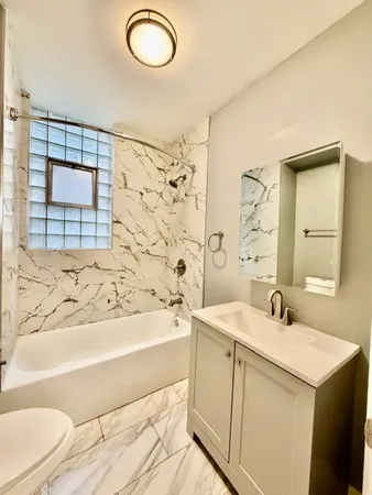 a bathroom with a sink a bathtub and a shower