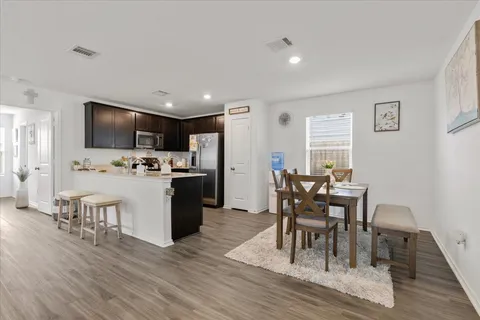 a view of kitchen with cabinets and wooden floor
