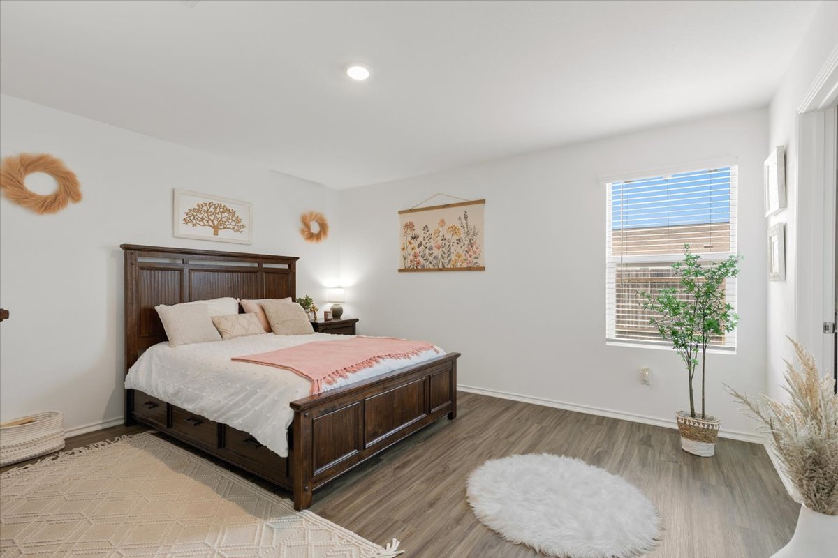 1220 Smallmouth Road Bastrop, TX 78602 - Photo 15 of 29 a bedroom with a bed and a window