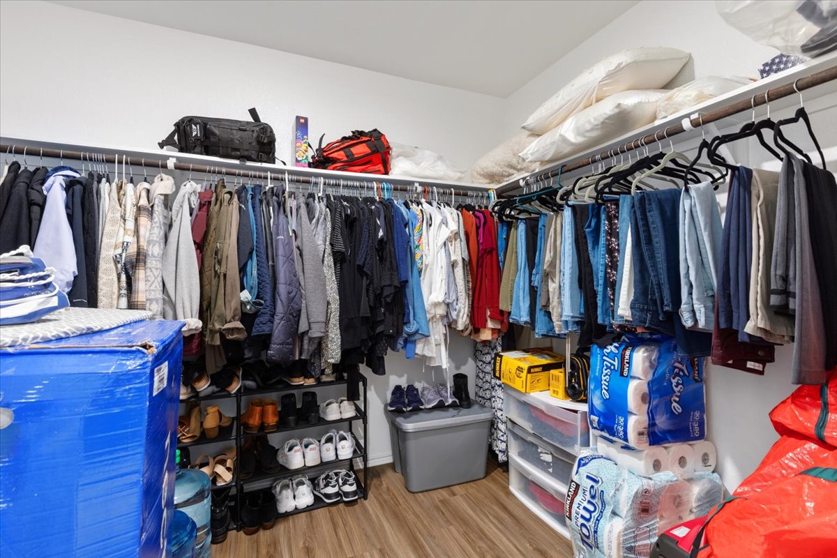 1220 Smallmouth Road Bastrop, TX 78602 - Photo 18 of 29 a view of walk in closet with clothes and shoes