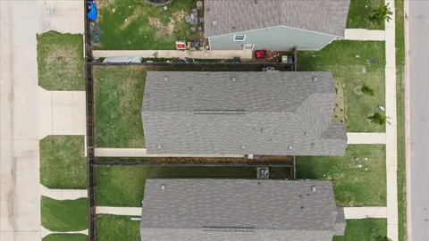 an aerial view of a house with a garden