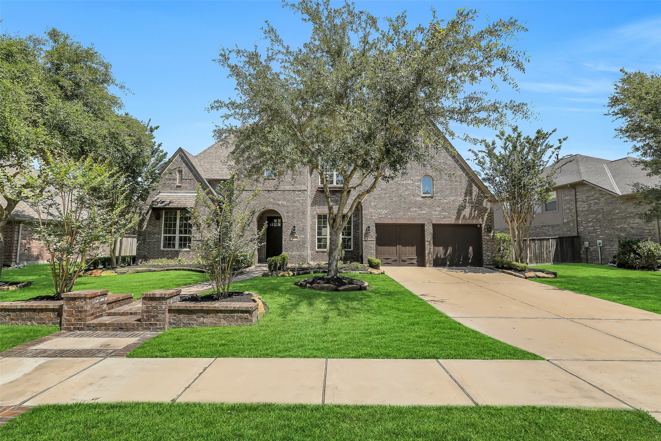 12207 Shorebridge Road Cypress, TX 77433 - Photo 2 of 41 a front view of a house with a yard and garage