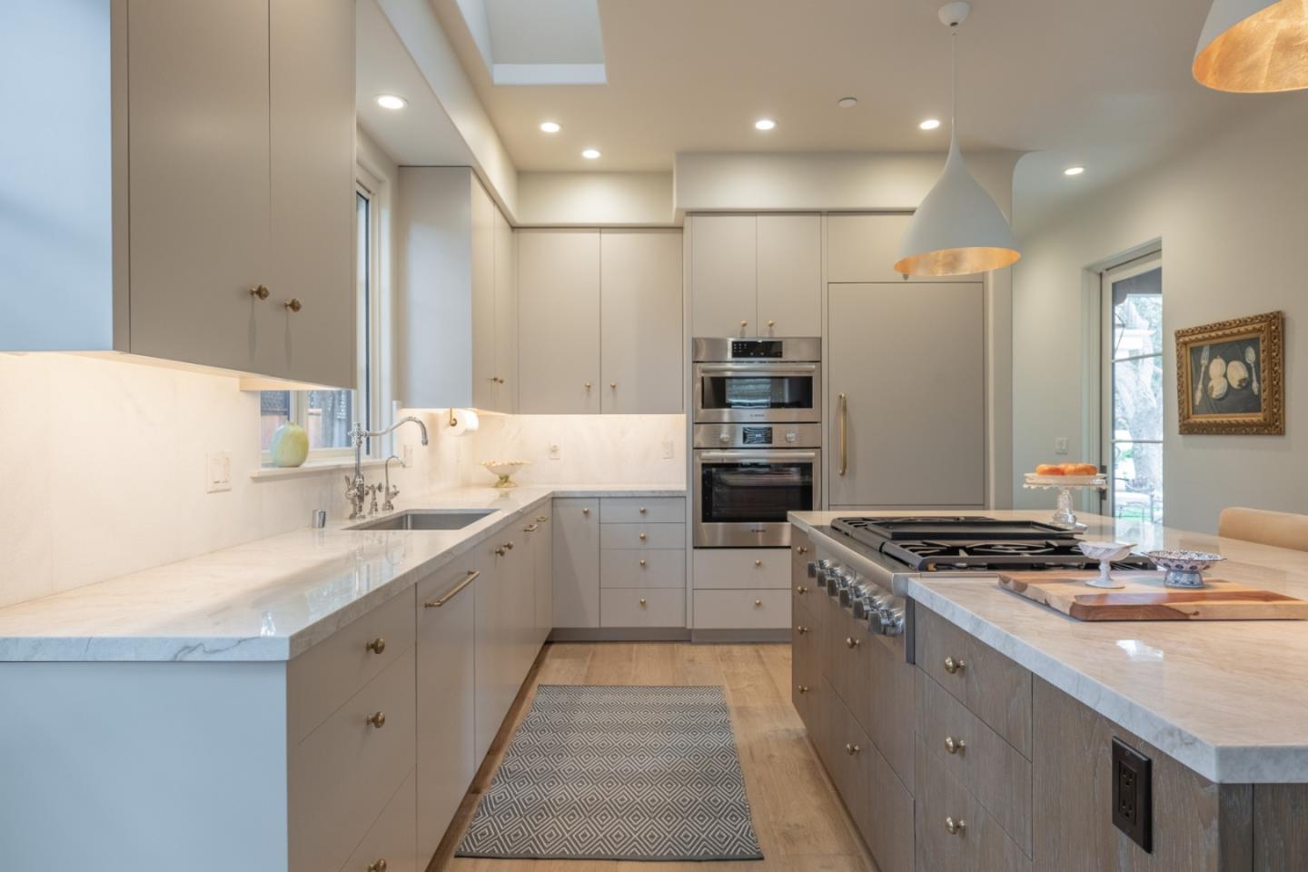1041 Rodeo Road Pebble Beach, CA 93953 - Photo 5 of 18 a kitchen with stainless steel appliances granite countertop a sink stove and refrigerator