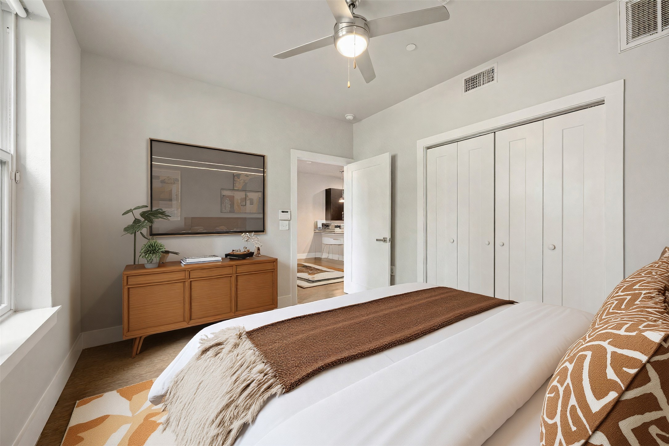 2804 Treble Lane, Unit 902 Austin, TX 78704 - Photo 19 of 31 a bedroom with a bed and a dresser