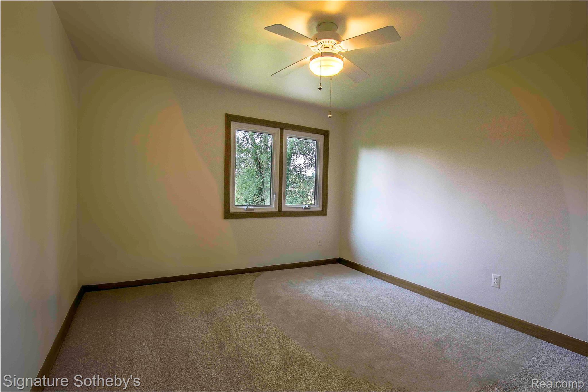 3131 Smugglers Ridge Walled Lake, MI 48390 - Photo 21 of 35 New Carpeting a ceiling fan with integrated lighting, and painted walls