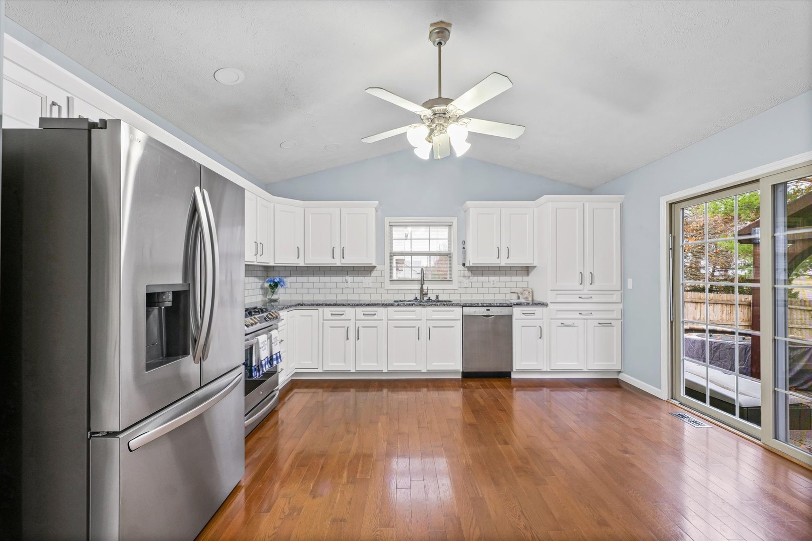 2414 Nugent Circle Urbana, IL 61802 - Photo 8 of 28 a kitchen with stainless steel appliances a refrigerator a sink cabinets and wooden floor
