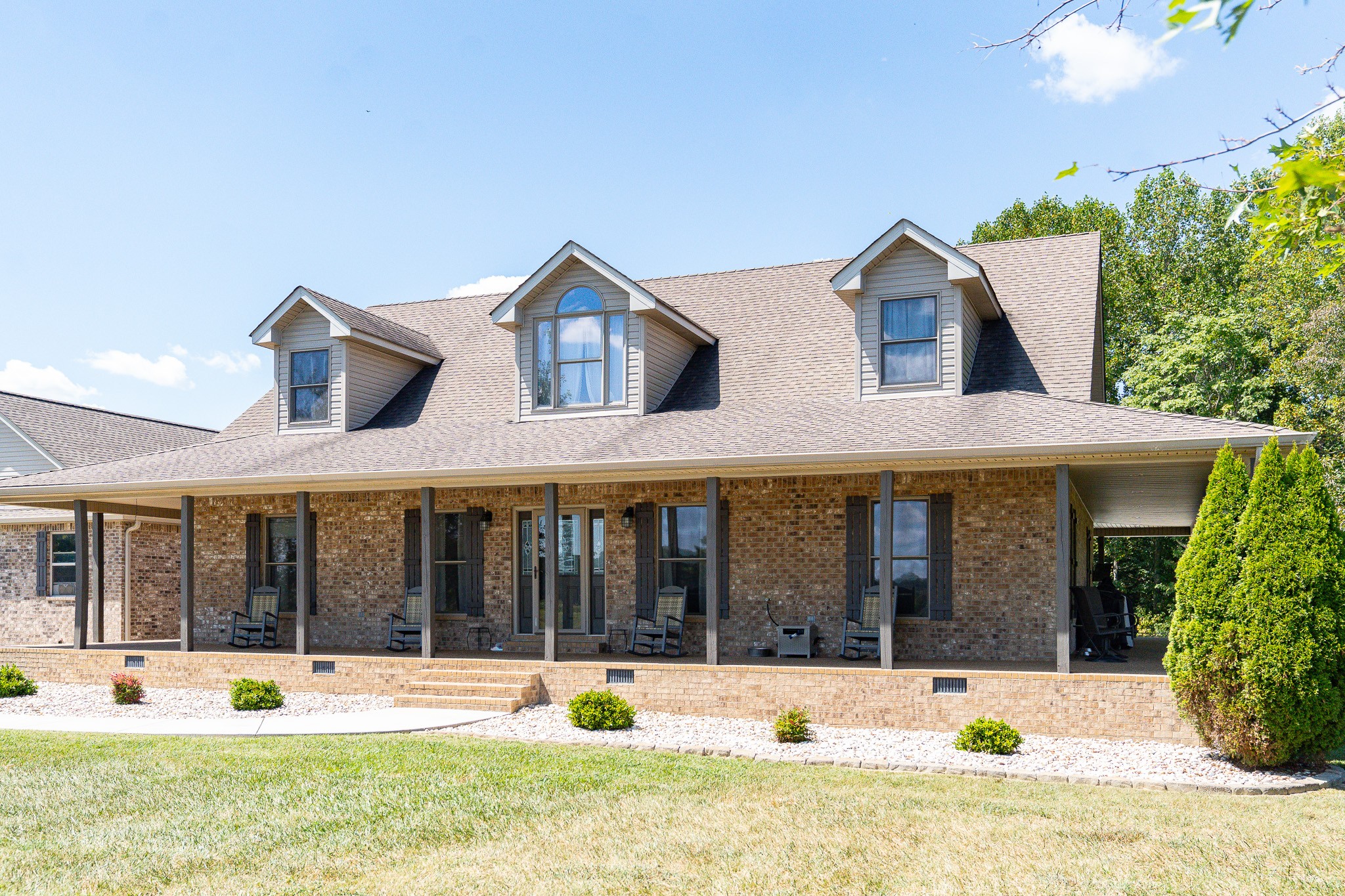 1243 Cave Hill Road Lafayette, TN 37083 - Photo 2 of 32 a view of a house with a yard and plants