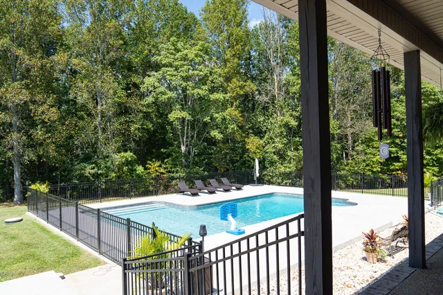 a view of a balcony with yard