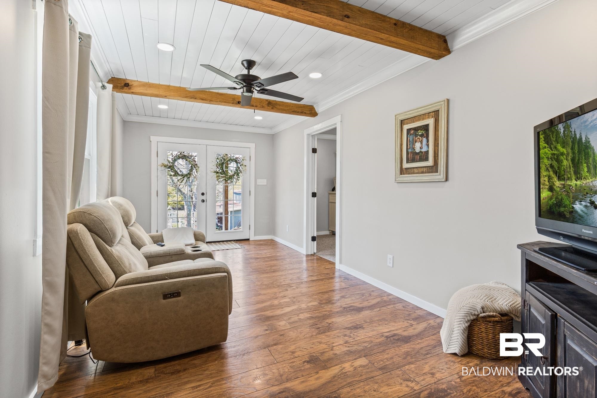 11100 Rhett McConnell Road Theodore, AL 36582 - Photo 10 of 47 Living room with ceiling fan, french doors, recessed lighting, dark wood-style floors, and a wooden ceiling with exposed beams