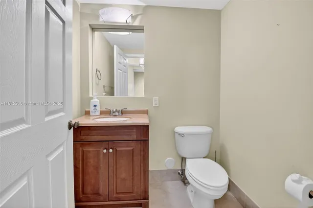 a bedroom with a bed and a ceiling fan