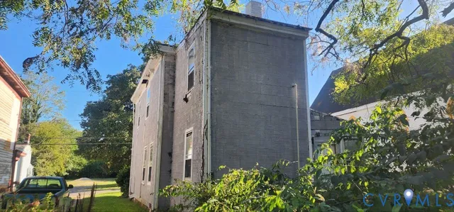 a view of a house with a tree