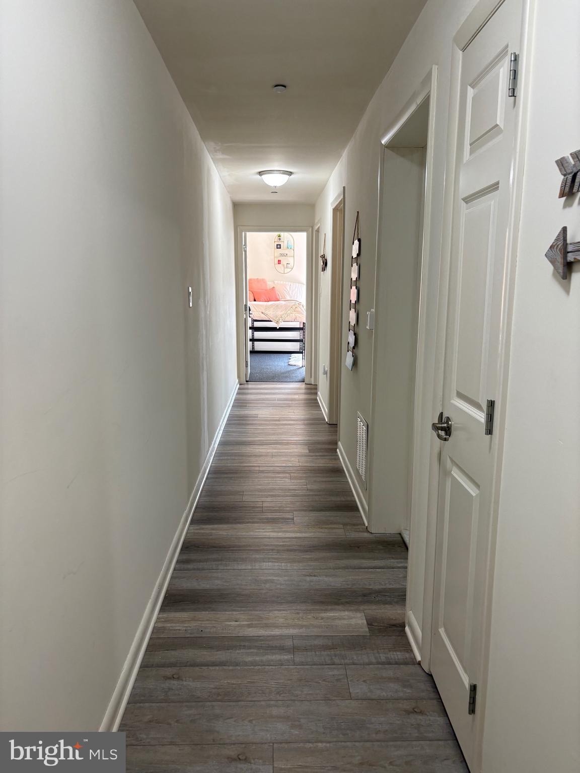 1000 Diamond Street, Unit G Philadelphia, PA 19122 - Photo 17 of 26 a view of a hallway with wooden floor and staircase