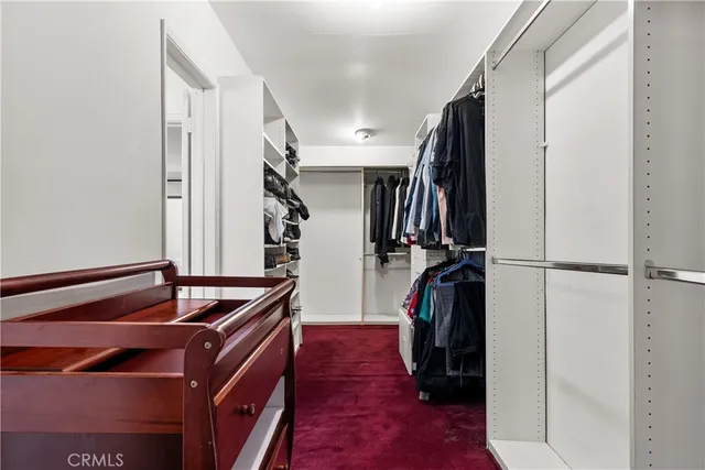 a bedroom with furniture and a wooden floor